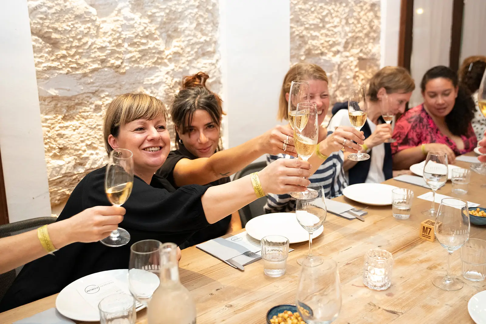 A toast at a group table at Andana